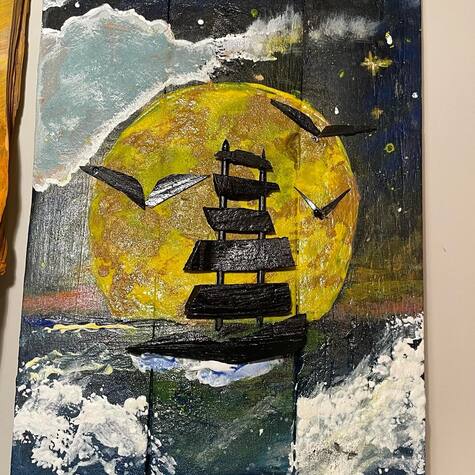 Czarny statek pod księżycem